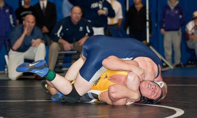 Academy Preparatory School wrestler Cole VanOhlen (top) moves into position to pin University of Maryland/Baltimore County's Justin Bowser in the national championship final for the 141-pound weight class. (U.S. Air Force photo/Tabitha Wilson)