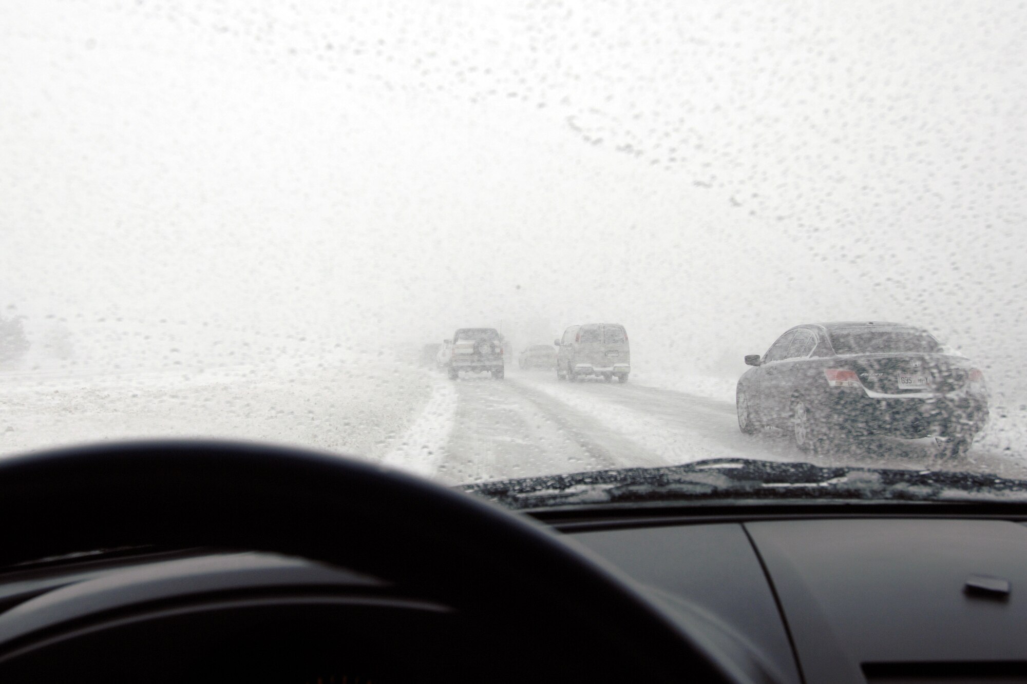 U.S. Air Force Academy employees in Colorado Springs, Colo., carefully make their way home during a snowstorm March 26. Personnel were released early so that they could get home before the worst of the storm hit. (U.S. Air Force photo)