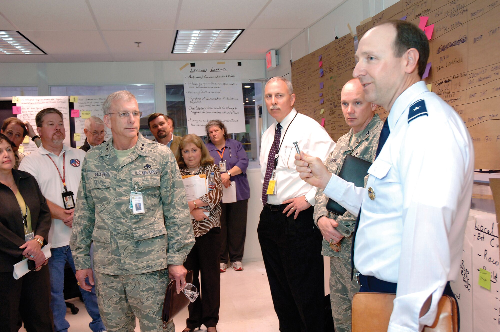 Brig. Gen. Bruce Litchfield, 76th Maintenance Wing commander, holds a bolt representing the accomplishments of a team which used value stream mapping to find process improvements for KC-135 maintenance. Next to General Litchfield from right are: Col. Kelly Larson, commander of Defense Logistics Agency Oklahoma City; Mr. John Over, executive director of the OC-ALC; and Maj. Gen. David Gillett, OC-ALC commander. (Air Force photo/Dave Faytinger)