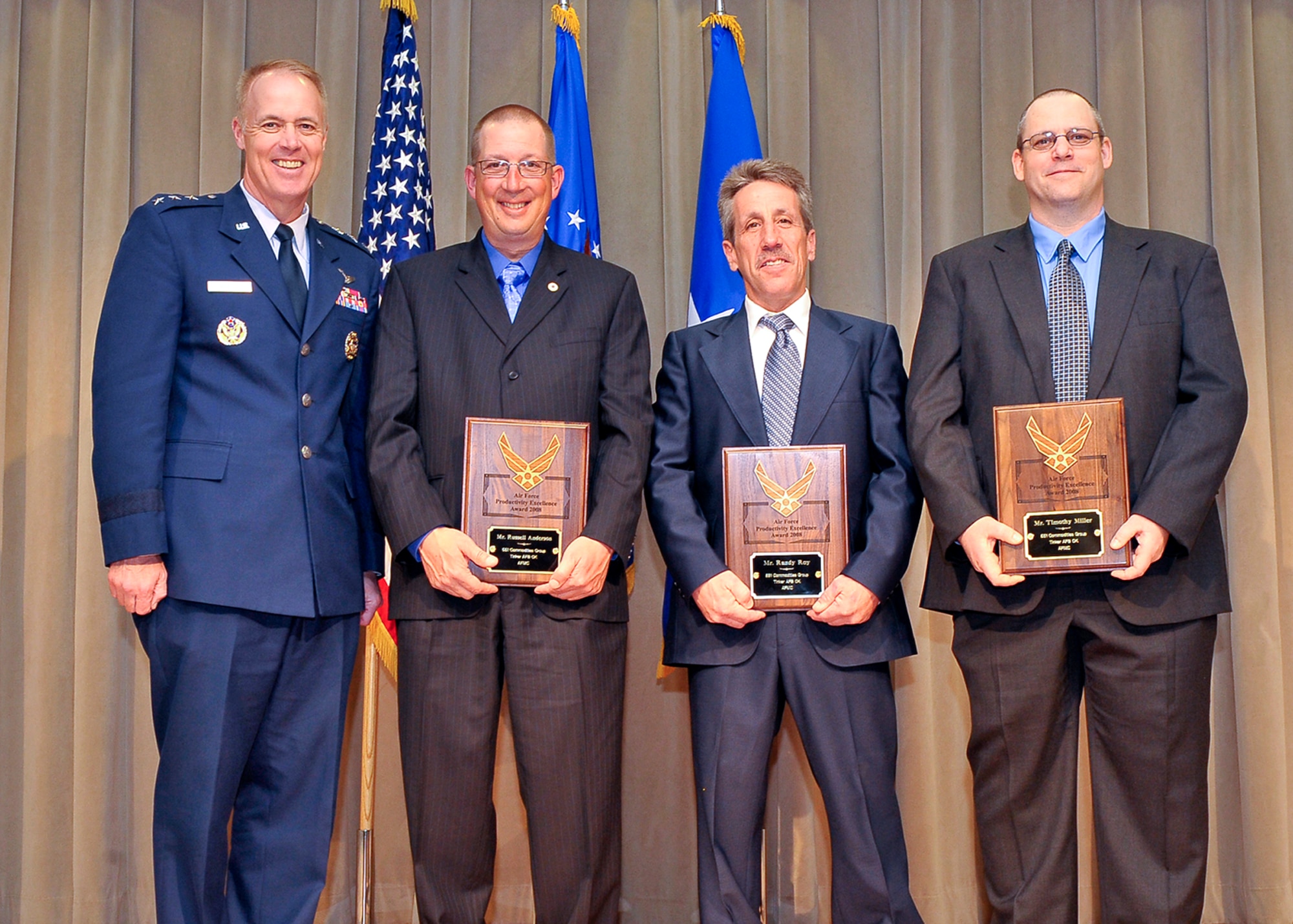 From left: Lt. Gen. Richard Newton III, Air Force deputy chief of staff for manpower, personnel and services poses with the 551st Commodities Maintenance Squadron’s Russell Anderson, Randy Roy and Timothy Miller during the Productivity Excellence Awards ceremony at the Pentagon in April. (Air Force photo)