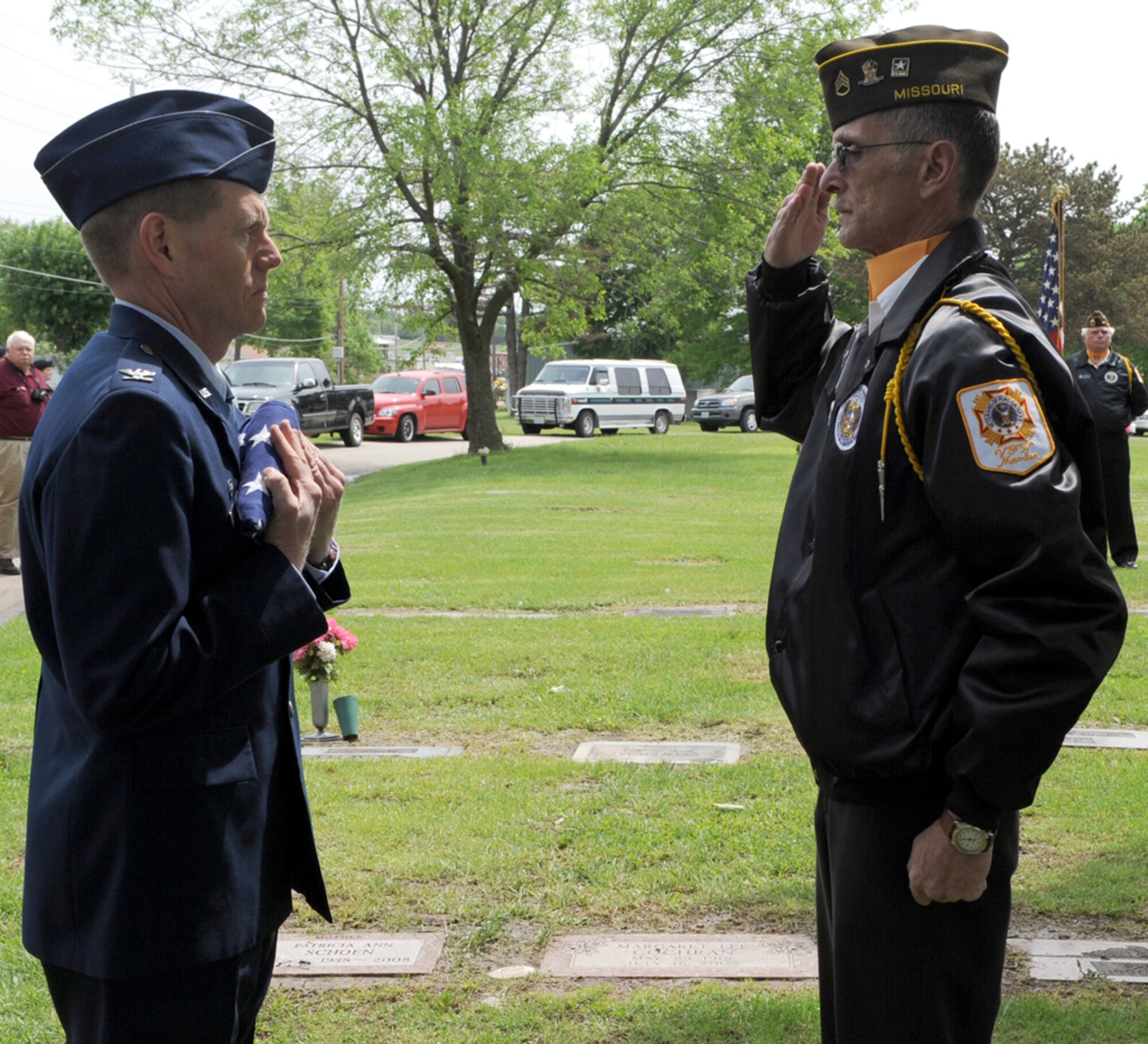 WHITEMAN AIR FORCE BASE, Mo. - Mr.  Joe Cochran, Veterans of Foreign Wars Post 2591 Honors Team, renders a salute to  Col. Robert Wheeler, 509th Bomb Wing commander after presentation of the flag flown at the 21st Memorial Wreath Laying Ceremony honoring 2nd Lt. George A Whiteman’s sacrifice during the attack on Pearl Harbor.  (U.S. Air Force photo/Airman 1st Class Carlin Leslie)  