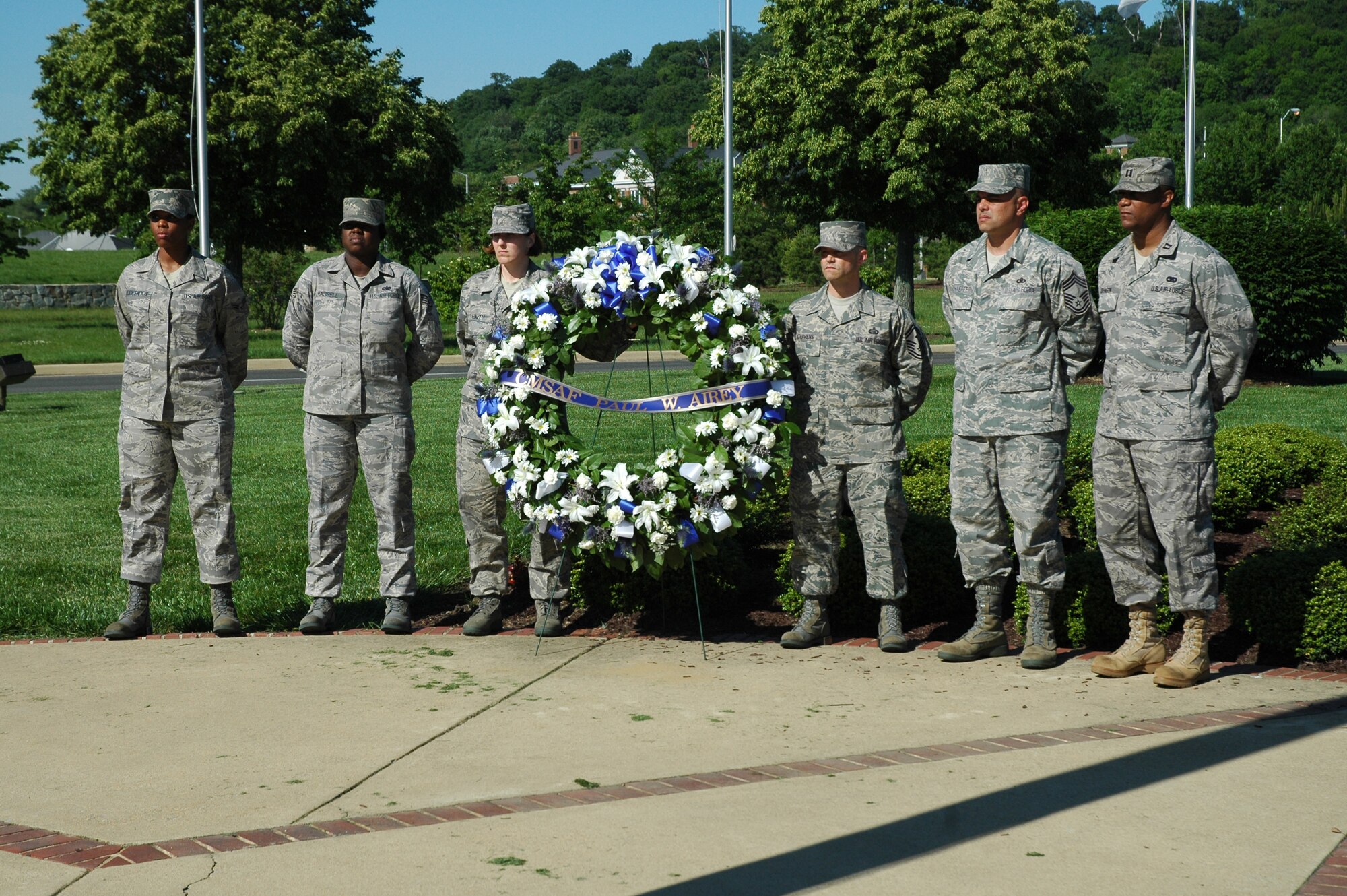Bolling Airmen prepare to lay a wreath in honor of former Chief Master Sgt. of the Air Force Paul W. Airey during a retreat ceremony May 20, 2009 on Bolling Air Force Base. The retreat ceremony was held in honor of Chief Airey, to allow individuals unable to attend his funeral at Arlington National Cemetery on May 28 a chance to pay their respects. (U.S. Air Force photo by Airman 1st Class Katherine Windish)