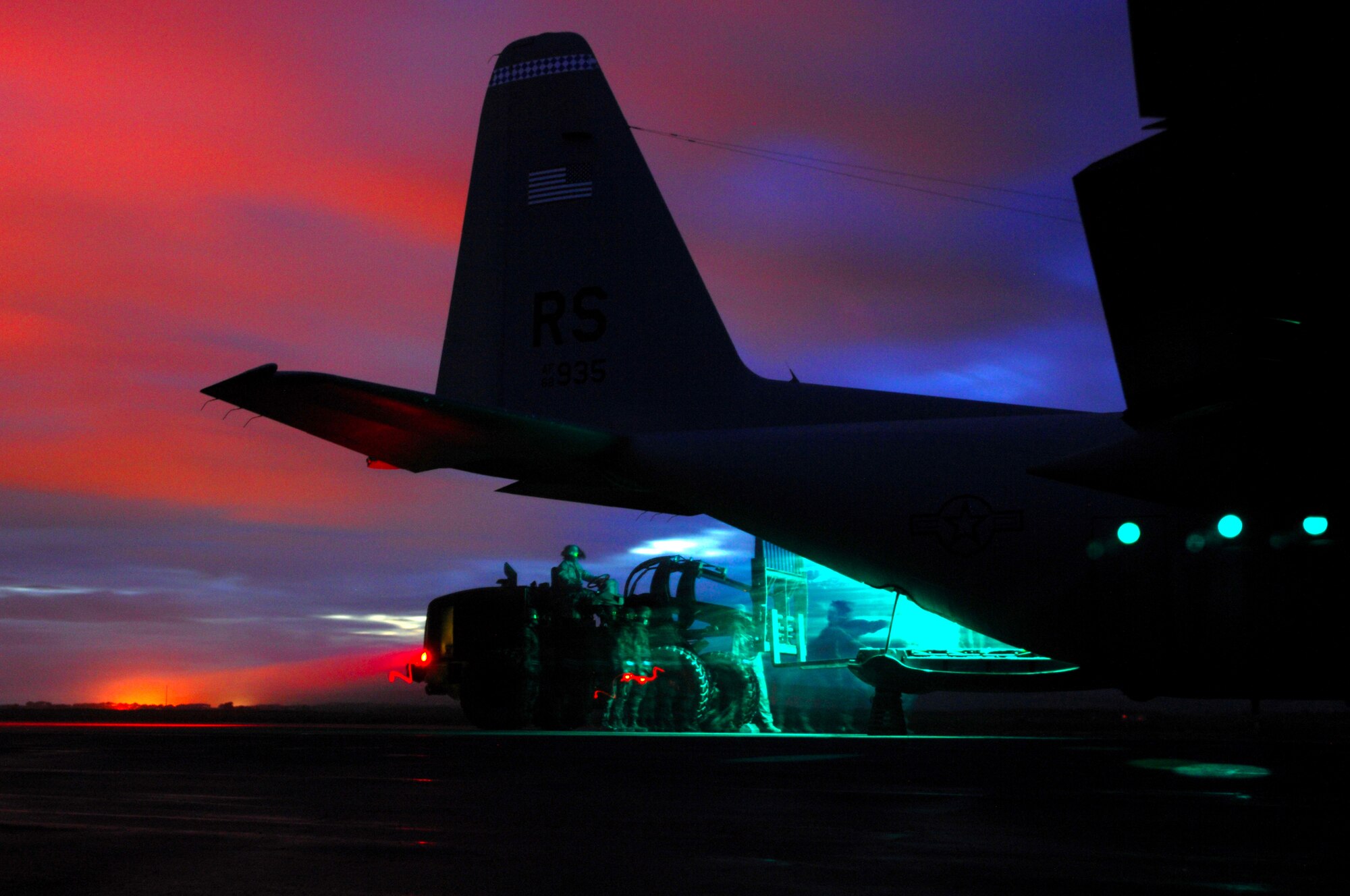 United States Air Force personnel participating in an eight day Operational Readiness Exercise prepare to load a C-130 Hercules to depart West Freugh Airfield, Scotland, May 19, 2009, where a portion of the exercise was held. (U.S. Air Force photo by Senior Airman Kenny Holston)