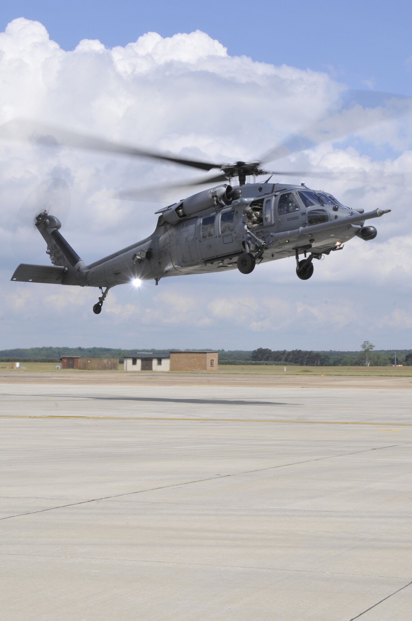 An HH-60G Pave Hawk lands at Royal Air Force Lakenheath, England, May 21, 2009. The HH-60G is landing to drop off Master Sgt. Darren Bradley, 56th Rescue Squadron HH-60G flight engineer, who completed his 5,000th flying hour in the HH-60G. (U.S. Air Force photo by Airman 1st Class Perry Aston) 