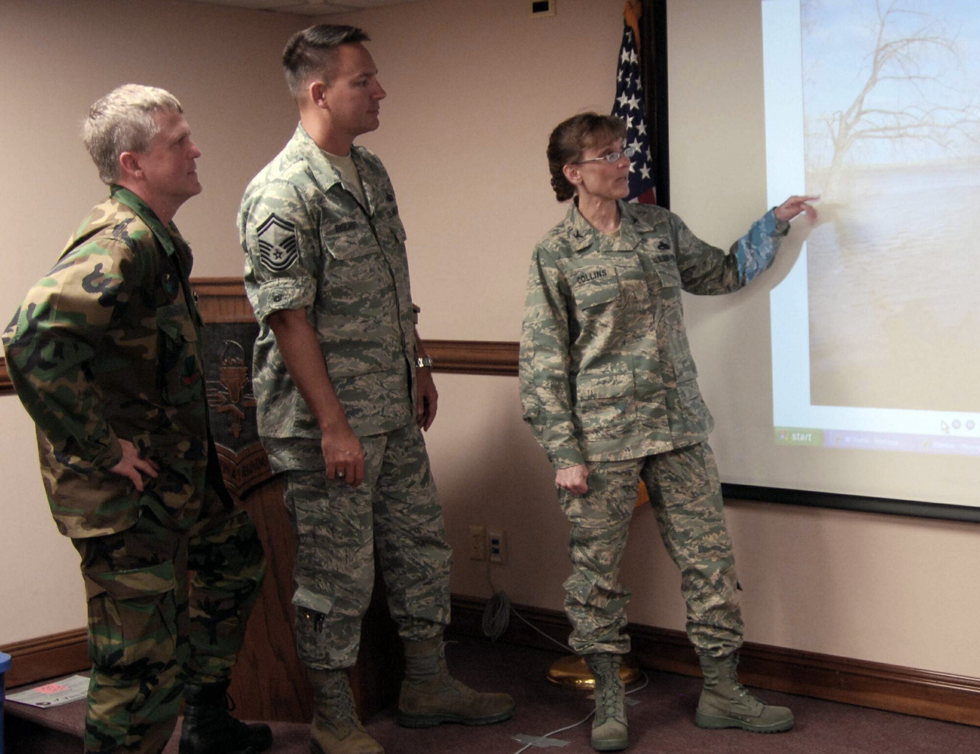 Col. Stacy Collins (right), an Air Force emergency preparedness liaison officer, discusses the North Dakota flood situation with Col. Jon Spangler and Senior Master Sgt. Brian Bischoff, all of whom attended a recent EPLO orientation at Tyndall Air Force Base, Fla. (U.S. Air Force photo/Lisa Norman)