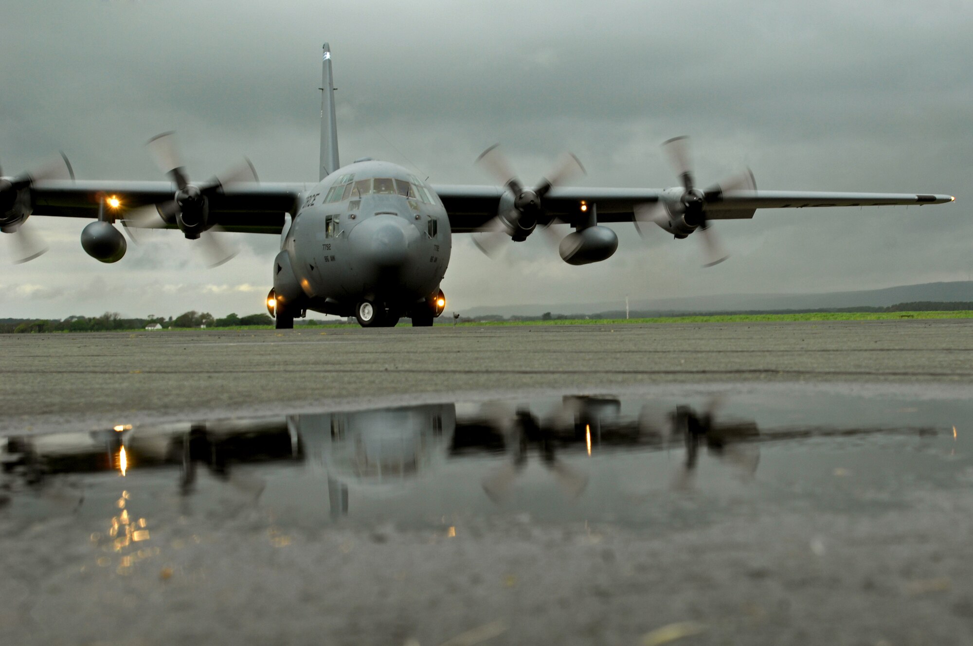 A United States Air Force C-130 Hercules arrives on a soggy West Freugh Airfield, Scotland, after severe thunder storms May 18, 2009 in support of an Operational Readiness Exercise held between Royal Air Force Fairford, England and West Freugh.  (U.S. Air Force photo by Senior Airman Kenny Holston)