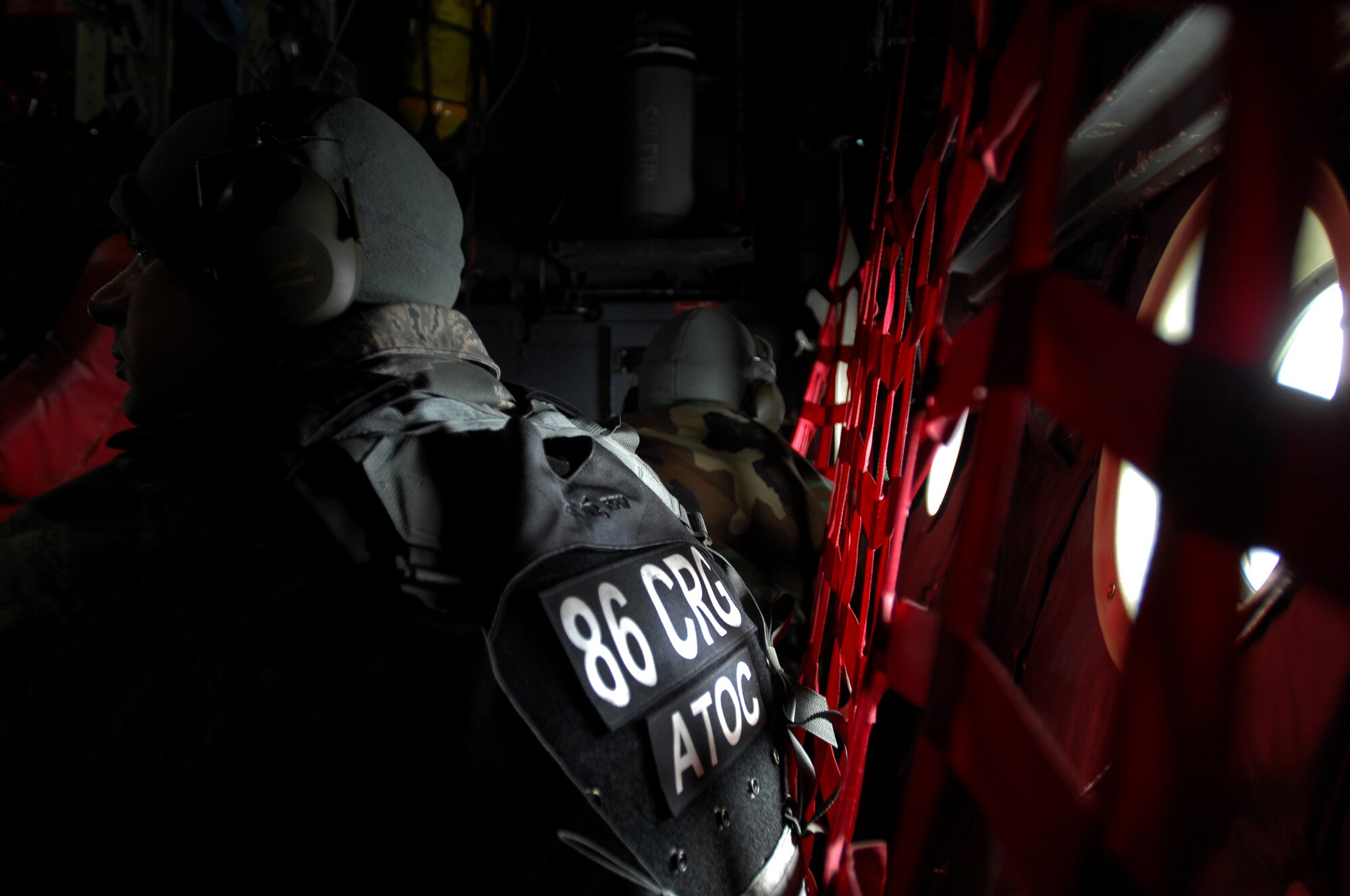 United States Air Force Staff Sgt. Darren Wiles, 86th Contingency Response Group air transportation, awaits arrival to West Freugh Airfield, Scotland from RAF Fairford, England, aboard a C-130 Hercules in support of an Operational Readiness Exercise May, 18, 2009. (U.S. Air Force photo by Senior Airman Kenny Holston)