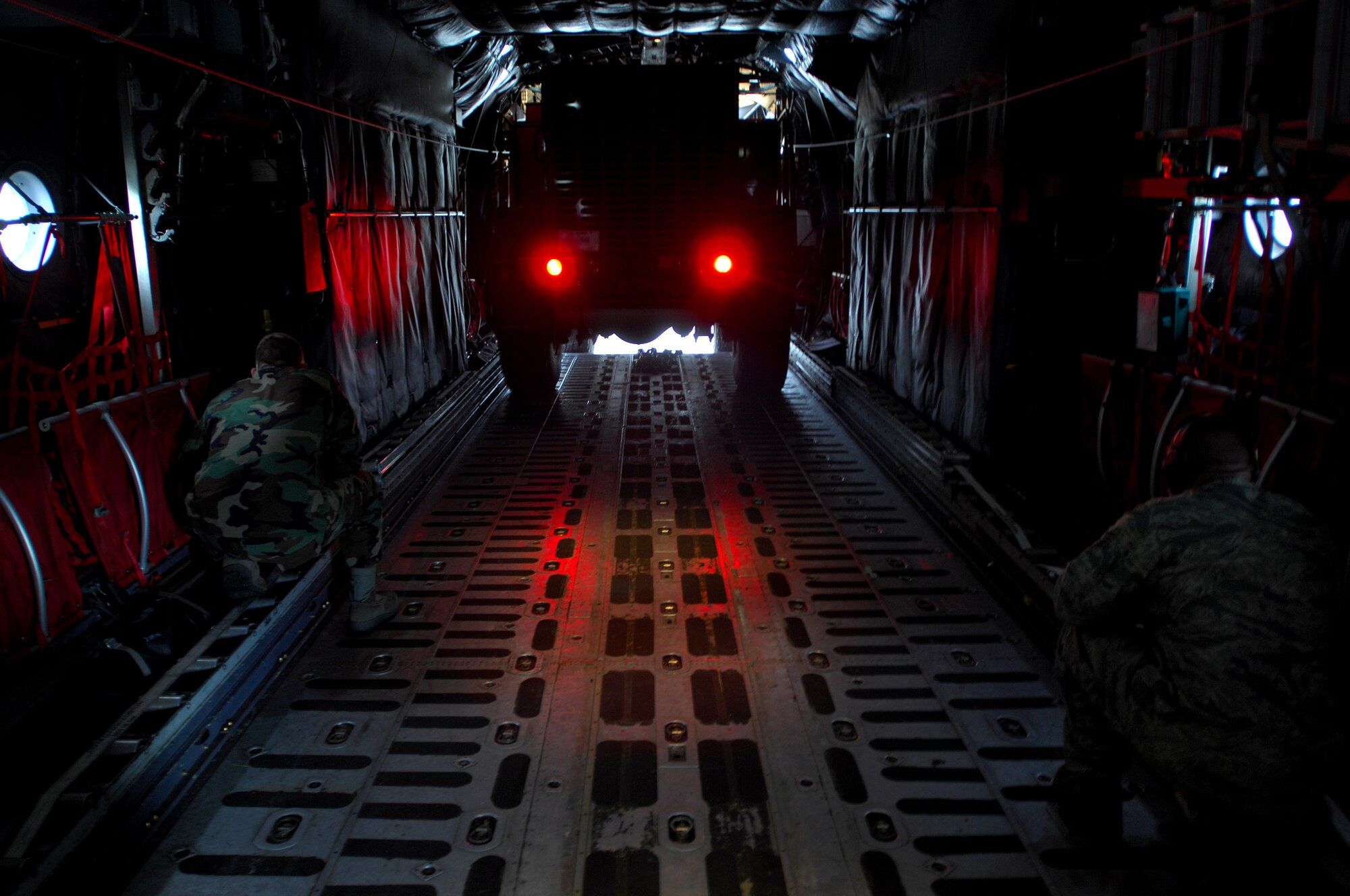 United States Air Force Staff Sgt. Andrew Bowman and Staff Sgt. Darren Wiles, 86th Contingency Response Group air transportation, and firefighters with the 835th Civil Engineer Squadron, load a fire truck on to a C-130 Hercules in support of an Operational Readiness Exercise, May 17, 2009, RAF Fairford, England. The fire truck was then flown to West Freugh Airfield, Scotland to begin the ORE. (U.S. Air Force photo by Senior Airman Kenny Holston)