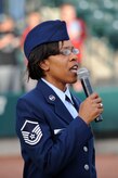 Master Sgt. Nichelle Cunningham sings the national anthem prior to the start of the Charleston RiverDogs baseball game held at Joseph P. Riley Jr., Park May 20. The RiverDogs are a Class-A affiliate of the New York Yankees and have celebrated more than ten years of baseball action in "The Joe." Sergeant Cunningham is assigned to the 315th Airlift Wing as a paralegal. (U.S. Air Force photo/Staff Sgt. Marie Cassetty)