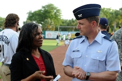 Col. John Wood speaks with Rose Alexander during the Charleston RiverDogs baseball game at Joseph P. Riley Jr., Park May 20. Colonel Wood is the 437th Airlift Wing commander and Mrs. Alexander is the chief of outreach for the 437 AW Public Affairs Office. (U.S. Air Force photo/Staff Sgt. Marie Cassetty)