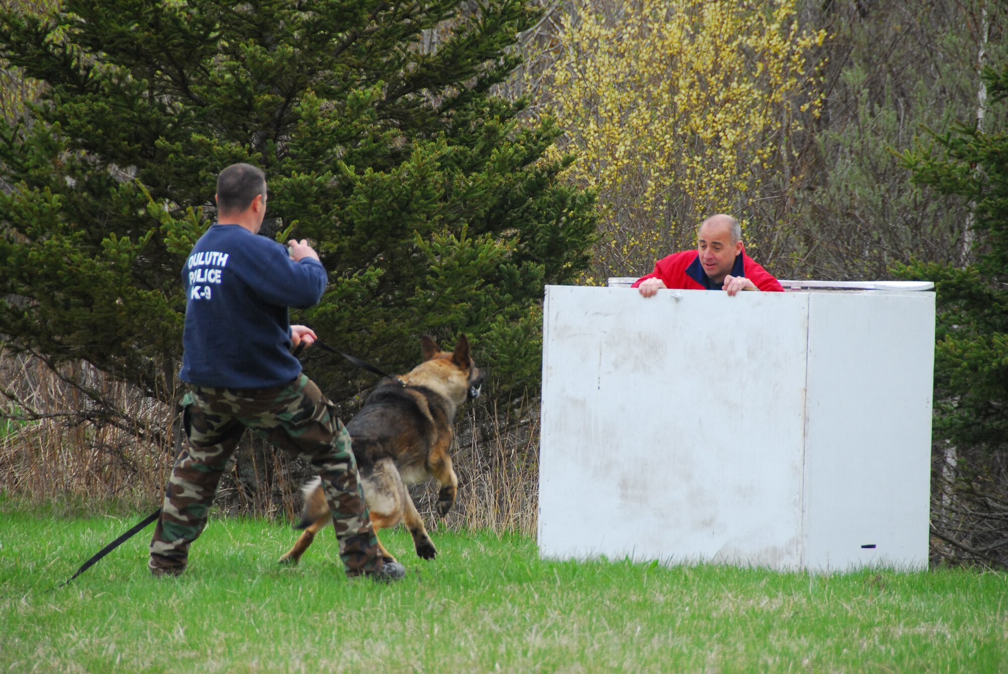 Duluth Police Department K-9 officers conduct training with their dogs at the Air National Guard Base in Duluth, Minn., May 12, 2009.  The 148th Fighter Wing Security Forces has opened their doors to welcome the four-legged guests to the base strengthening the effort of joint training in the community. (U.S. Air Force photo by Tech. Sgt. Brett Ewald) 