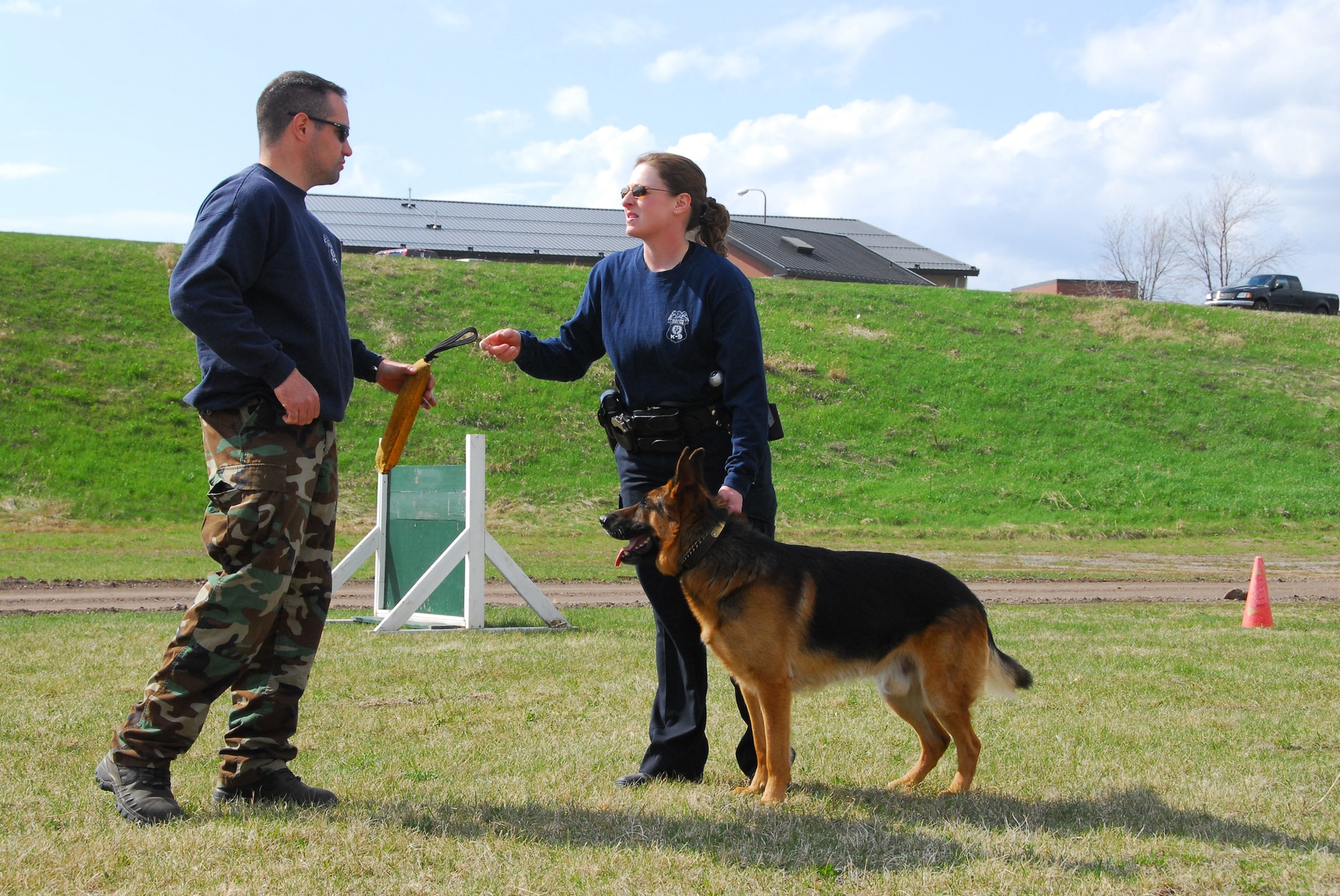 Duluth Police Department K-9 officers conduct training with their dogs at the Air National Guard Base in Duluth, Minn., May 11, 2009.  The 148th Fighter Wing Security Forces has opened their doors to welcome the four-legged guests to the base strengthening the effort of joint training in the community. (U.S. Air Force photo by Tech. Sgt. Brett Ewald) 