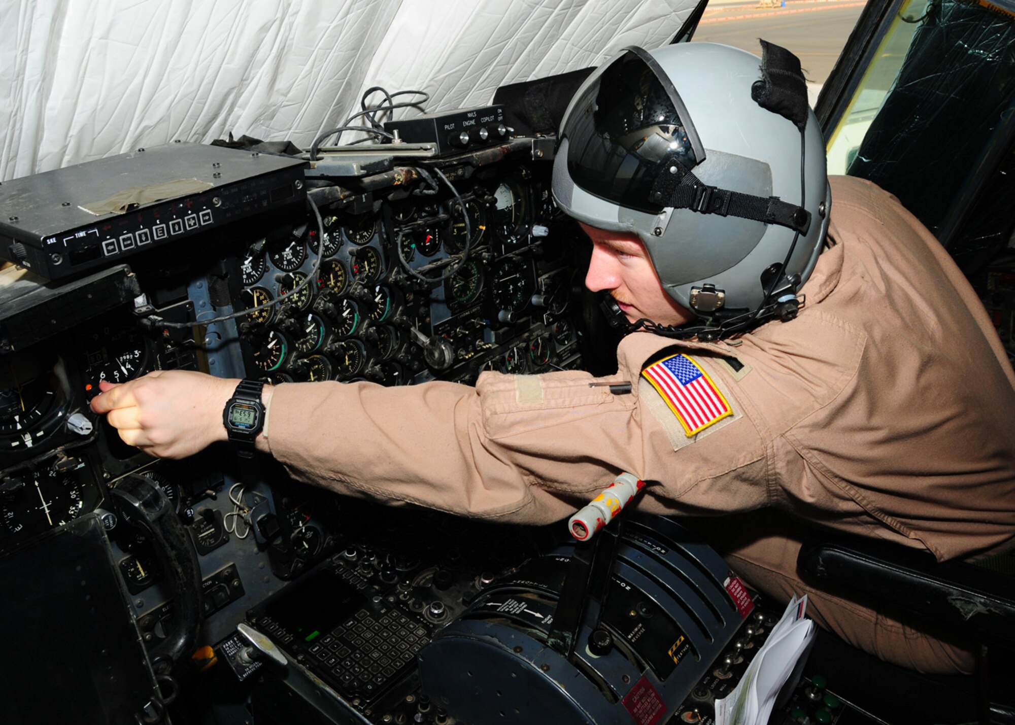 SOUTHWEST ASIA -- 1st Lt. Gabriel Frusha, 737th Expeditionary Airlift Squadron co-pilot, sets the pilot's altimeter during his pre-flight check at an air base in Southwest Asia, May 19. The altimeter shows the aircraft's altitude above sea level. Lieutenant Frusha is currently deployed from Yokota Air Base, Japan, and is originally from Lafayette, La. (U.S. Air Force photo/ Senior Airman Courtney Richardson)
