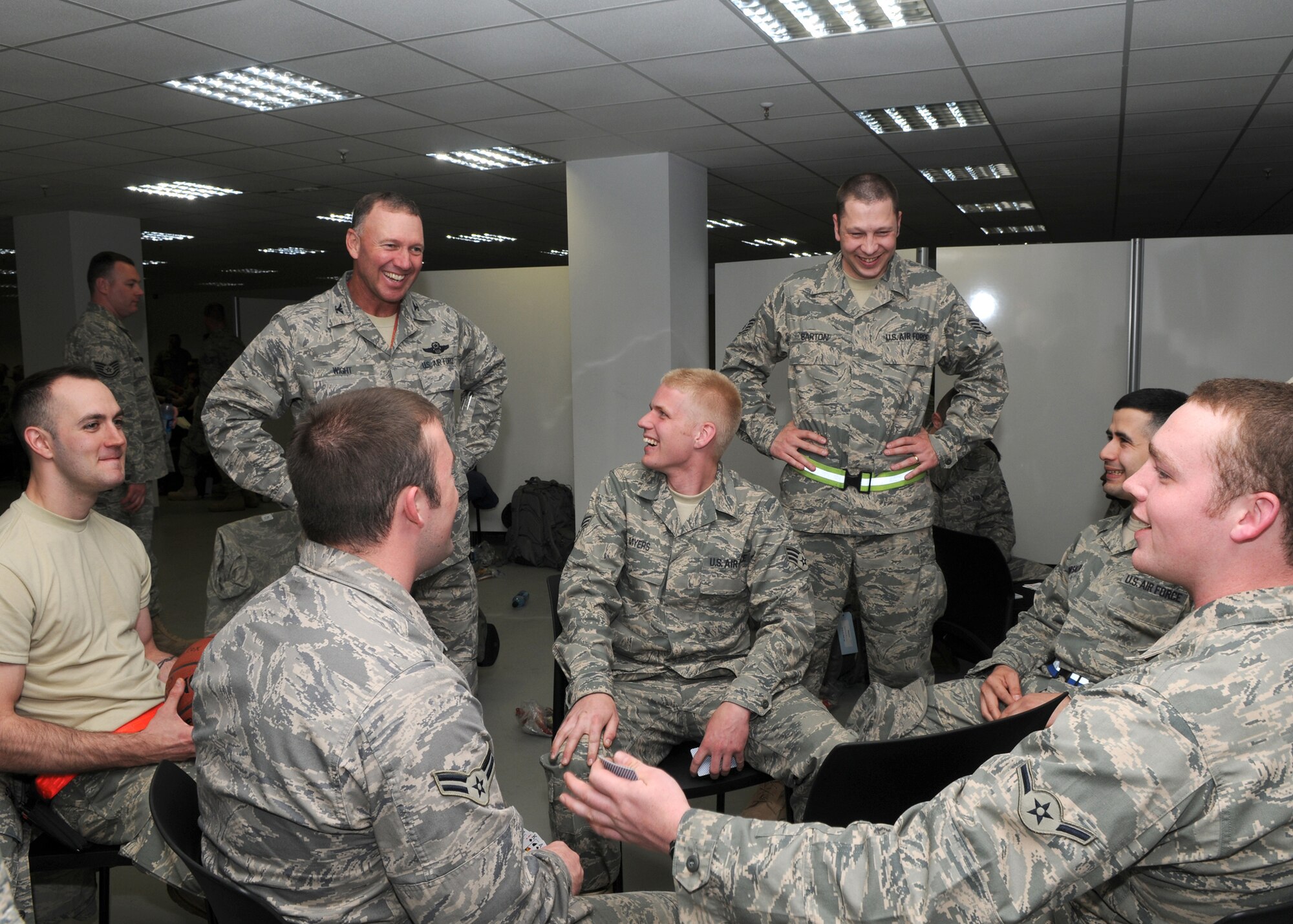 SPANGDAHLEM AIR BASE, Germany -- Col. Lee T. Wight, 52nd Fighter Wing commander, spends time with 52nd Equipment Maintenance Squadron Airmen May 19, 2009.  Sabers found many ways to pass the time waiting for their flight to various locations downrange to support overseas contingency operations.  (U.S. Air Force photo by Staff Sgt. Heather M. Norris)