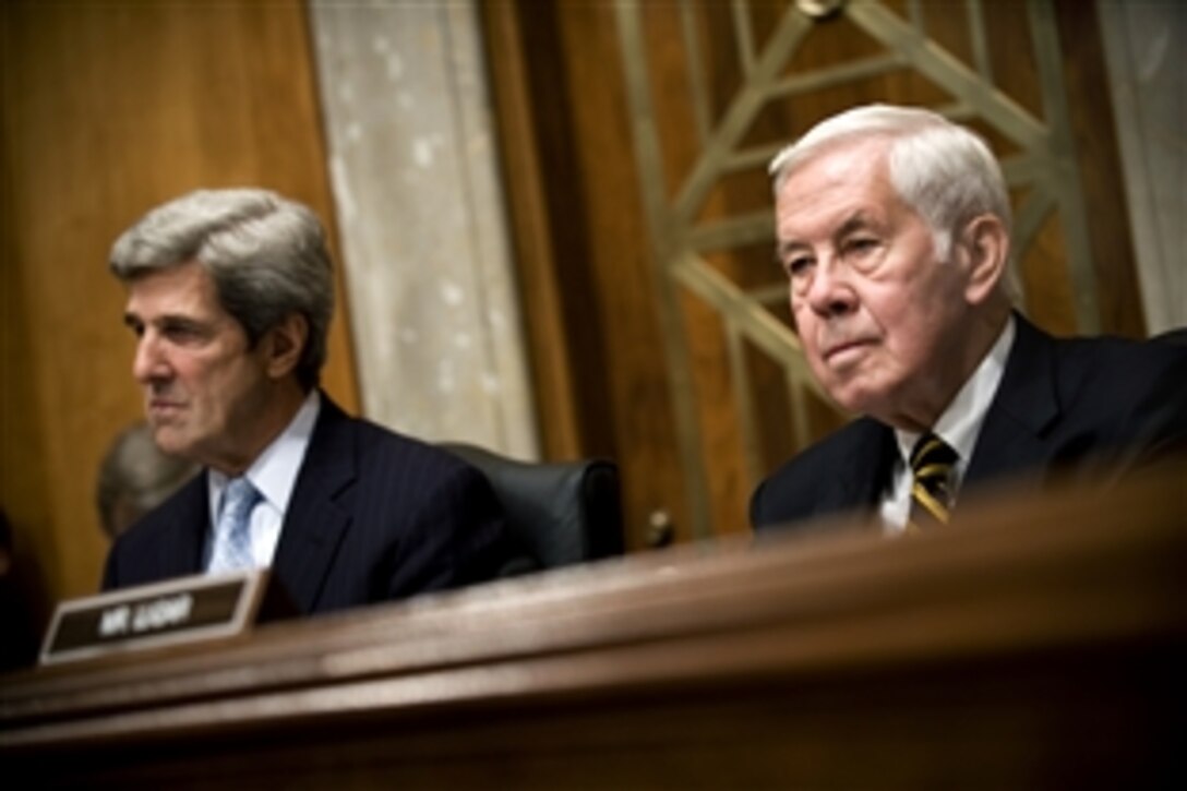 Sen.John Kerry, left, chairman of the Senate Foreign Relations Committee, and ranking minority member Sen. Richard Lugar listen to the testimony of Navy Adm. Mike Mullen, chairman of the Joint Chiefs of Staff, in Washington, D.C., May 21, 2009. Mullen answered questions about the new strategy for Afghanistan and Pakistan and proposed funding under that would triple non-military funding to Pakistan over the next decade.