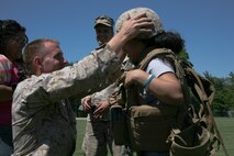 Marines from Special Marine Air Ground Task Force New York arrive at a landing zone for a helicopter raid demonstration. The Marines also allowed visitors to try on their gear as part of the Fleet Week experience. (Official Marine Corps photo by Sgt Steve Cusham)