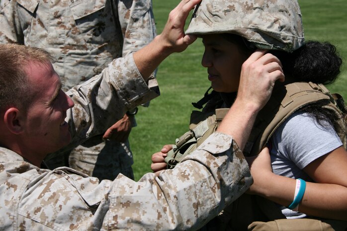 Marines from Special Marine Air Ground Task Force New York arrive at a landing zone for a helicopter raid demonstration. The Marines also allowed visitors to try on their gear as part of the Fleet Week experience. (Official Marine Corps photo by Sgt Steve Cusham)