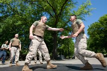 Two Marines square off during a demonstration of Marine Corps Martial Arts during Marine Day in Central Park May 21. This event was just one of many the Marines of 24th Marine Expeditionary Unit and Special Purpose Marine Air Ground Task Force - New York will participate in during Fleet Week. (Official Marine Corps photo by: Cpl. Patrick Fleischman)