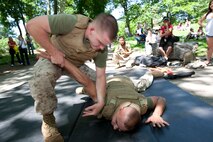 Two Marines square off during a demonstration of Marine Corps Martial Arts during Marine Day in Central Park May 21. This event was just one of many the Marines of 24th Marine Expeditionary Unit and Special Purpose Marine Air Ground Task Force - New York will participate in during Fleet Week. (Official Marine Corps photo by: Cpl. Patrick Fleischman)