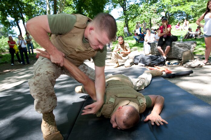 Two Marines square off during a demonstration of Marine Corps Martial Arts during Marine Day in Central Park May 21. This event was just one of many the Marines of 24th Marine Expeditionary Unit and Special Purpose Marine Air Ground Task Force - New York will participate in during Fleet Week. (Official Marine Corps photo by: Cpl. Patrick Fleischman)