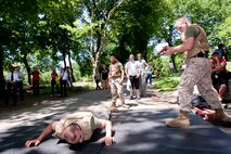 Two Marines square off during a demonstration of Marine Corps Martial Arts during Marine Day in Central Park May 21. This event was just one of many the Marines of 24th Marine Expeditionary Unit and Special Purpose Marine Air Ground Task Force - New York will participate in during Fleet Week. (Official Marine Corps photo by: Cpl. Patrick Fleischman)