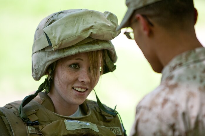Tasha Adkins, a visitor from Gallipolis, Ohio, tries on body armor to get a feeling of what it is like to be a Marine during Marine Day in Central Park May 21. This event was just one of many the Marines of 24th Marine Expeditionary Unit and Special Purpose Marine Air Ground Task Force - New York will participate in during Fleet Week. (Official Marine Corps photo by: Cpl. Patrick Fleischman)