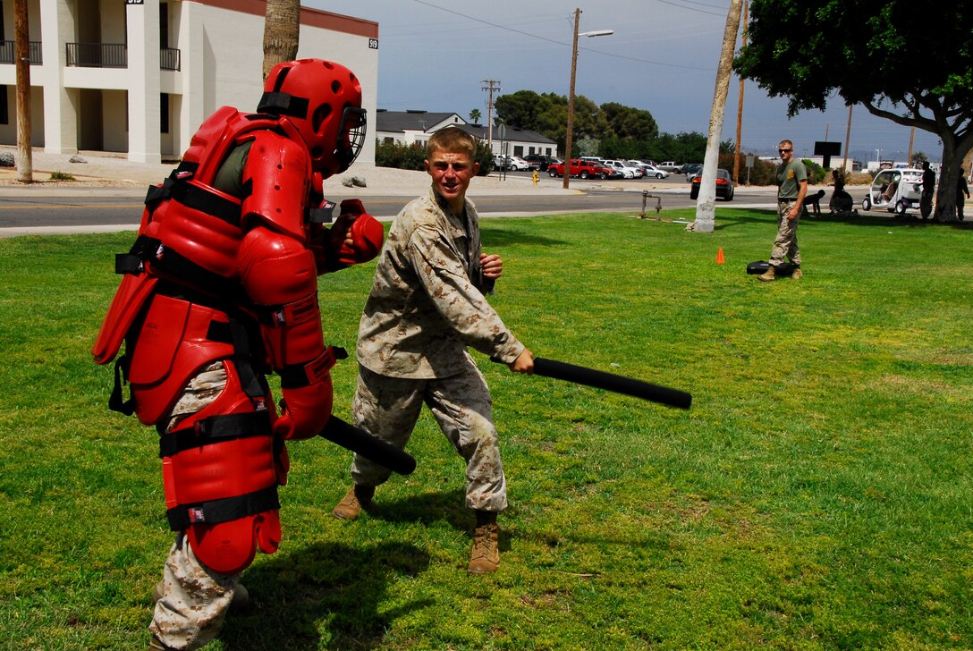 Student Cpl. Stolf Short fights off one of his instructors at Marine Corps Air Station Yuma, Ariz. May 21, 2009 after being sprayed with Oleoresin Capsicum, a nonlethal weapon used by law enforcement. This Marine Corps Martial Arts Program instructor course is scheduled to graduate May 29, 2009 at the station chapel.(Photo by Cpl. Laura A. Mapes)