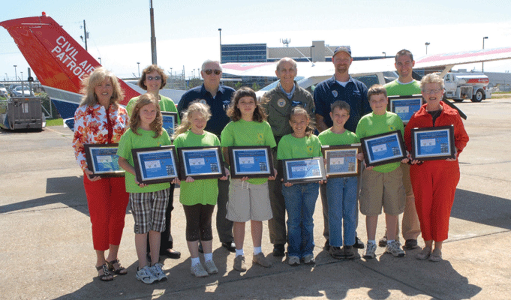 Pictured are the Civil Air Patrol essay winners with teachers, principals and CAP pilots. Front row from left are Bear Elementary School students Katie Carothers, Rebecca Liepins, and Mara Bradford; Dalraida Elementary students Kaitlyn McDonald, Thomas Cauthen and Jarrod Castleberry and Dalraida Elementary Principal Elise Keith. Back row from left are Bear Elementary School Principal Liz Hill, Bear Elementary Teacher Kris White; Alabama Wing CAP pilots Lt. Col. Sam Sneed, Maj. Ray Hara, and 2nd Lt. Dan Farmer; and Dalraida Elementary Teacher Bryan Raye. (Courtesy photo)