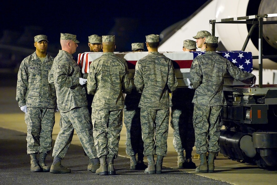 An Air Force carry team transfers the remains of U.S. Air Force 1st Lt. Roslyn L. Schulte, 25, of St. Louis, Mo., at Dover Air Force Base, Del., May 22. Lieutenant Schulte was assigned to the Headquarters, Pacific Air Forces Command, Hickam Air Force Base, Hawaii. (US Air Force photo/Roland Balik) 