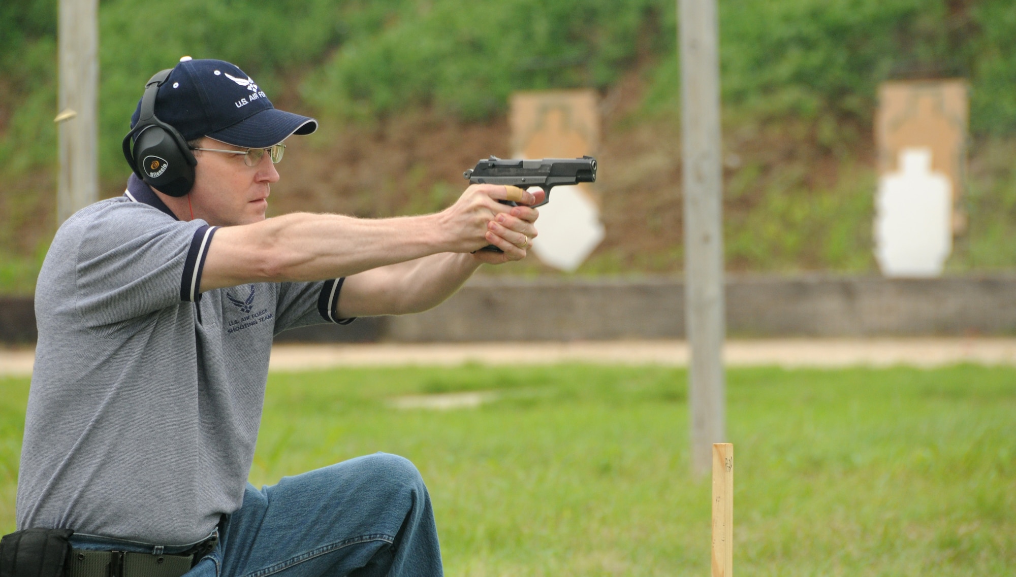 ALTUS AIR FORCE BASE, Okla --- Lt. Col. Thomas Reardon, 54th Air Refueling Squadron commander, fires a Ruger P85 pistol at the “Shoot-out” competition held between Air Force and county law enforcement, in support of police week, at the Altus Police Department Firing Range May 14. Colonel Reardon finished in the top ten by completing the target course in 101.28 seconds. (U.S. Air Force photo by Senior Airman Cherice Bryant)
