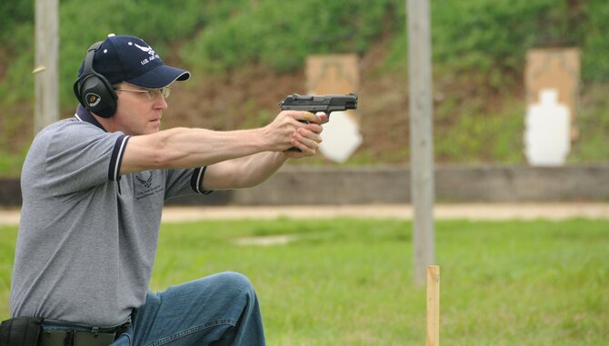 ALTUS AIR FORCE BASE, Okla. -- Lt. Col. Thomas Reardon, 54th Air Refueling Squadron commander, fires a Ruger P85 pistol at the “Shoot-out” competition held between Air Force and county law enforcement in support of police week at the Altus Police Department Firing Range May 14. Colonel Reardon finished in the top 10 by completing the target course in 101.28 seconds. (U.S. Air Force photo/Senior Airman Cherice Bryant) 
