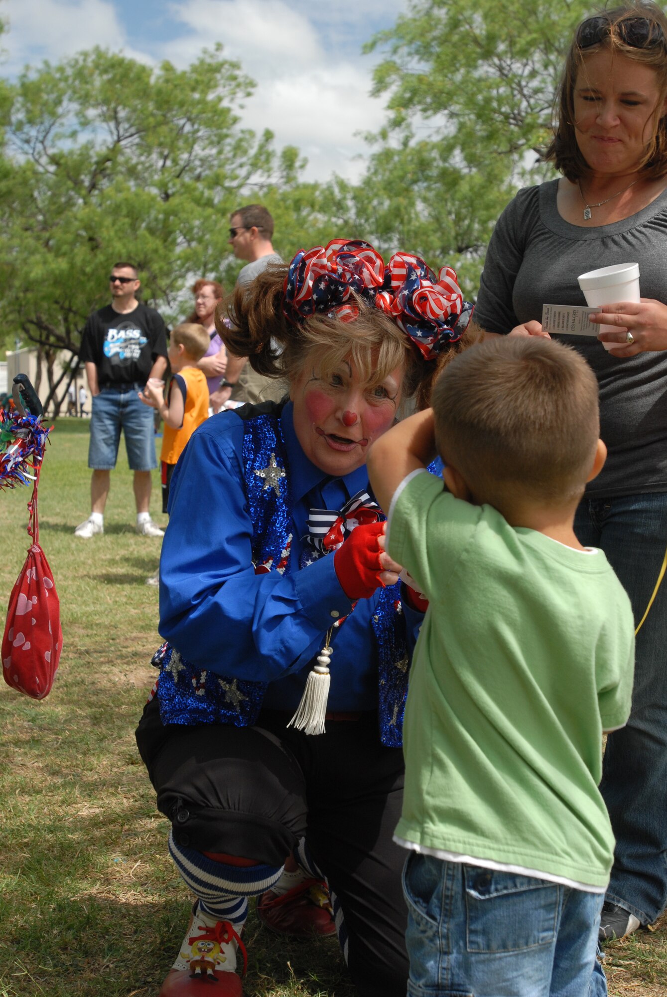 Among the activities for children were face painting (shown here), bounce houses, pony rides and a rock climbing wall. (U.S. Air Force photo by Airman Clayton Lenhardt)
