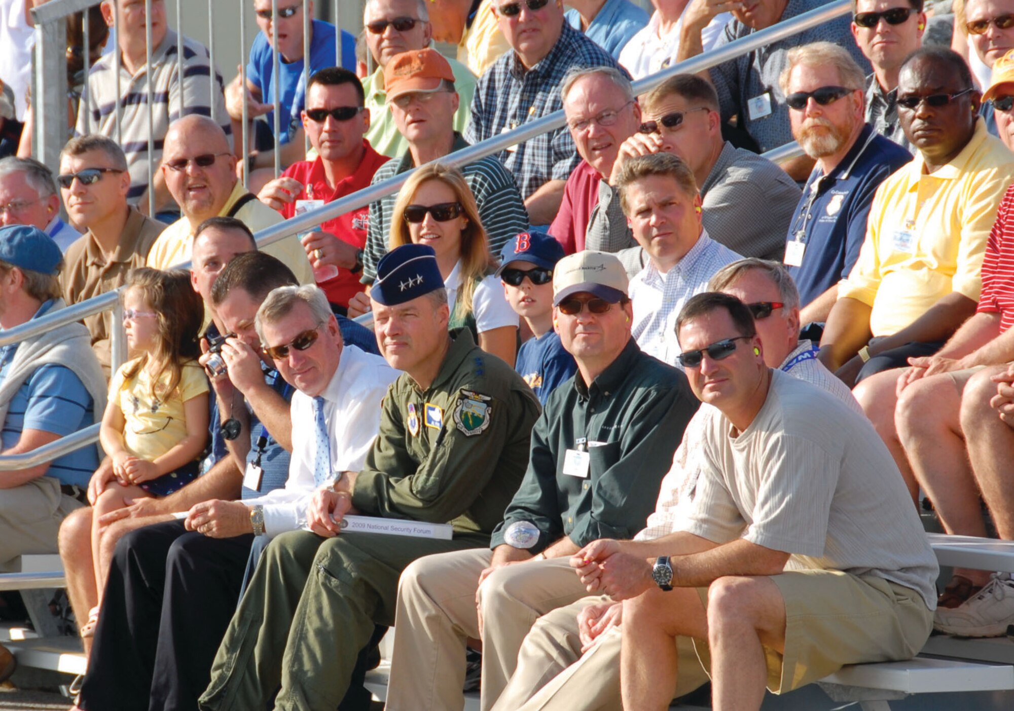 Montgomery Mayor Todd Strange (center left) and Air University commander Lt. Gen. Allen Peck (center right) watch as aircraft perform an aerial demonstration for attendees and sponsors of the National Security Forum at Maxwell. (U.S. Air Force photo/Jamie Pitcher)