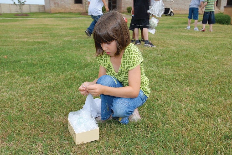 Rheanna Herrera displays a uniquely designed package. (U.S. Air Force photo/Jamie Pitcher)