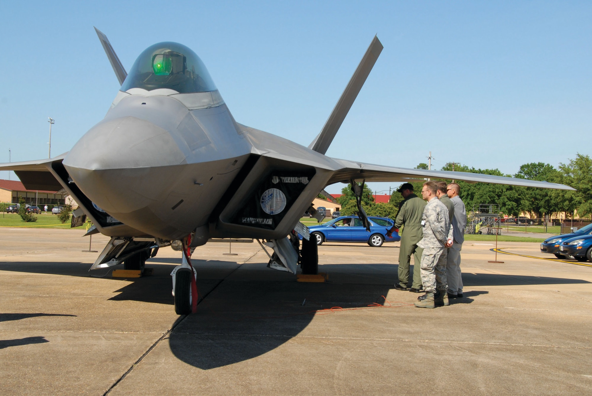 Maxwell personnel get a closer look at the Air Force's newest jet, the F-22 Raptor, after a practice flight Tuesday. The F-22 Demonstration Team was at Maxwell this week for the National Security Forum and did one of 16 demonstration flights the team will conduct this year. (U.S. Air Force photo/Jamie Pitcher)
