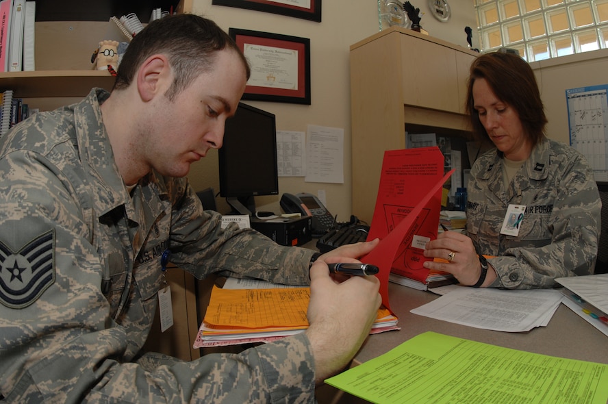 MINOT AIR FORCE BASE, N.D. -- Capt. Pam Stewart and Tech. Sgt. William Lewis inspect records at the 5th Medical Group during the Nuclear Surety Inspection here May 14. An NSI is designed to evaluate a unit's readiness to execute nuclear operations. Areas to be evaluated during the NSI include operations, maintenance, security, and support activities needed to ensure the wing performs its mission in a safe, secure and reliable manner. This no-notice inspection concluded May 22. (U.S. Air Force photo by Staff Sgt. Angel Gallardo)
