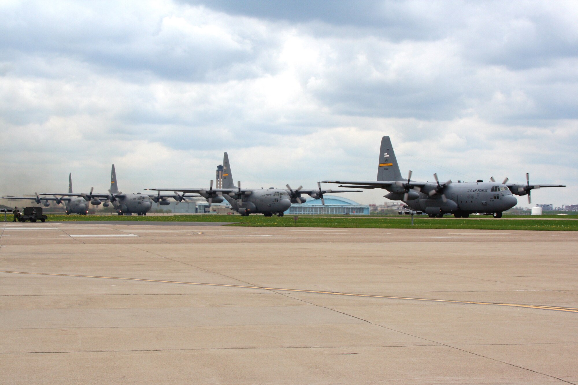 Four Air Force Reserve Command C-130's from the 758th Airlift Squadron take off on their way to conduct a training exercise, May 2, 2009 (Photo by Tech Sgt. Ian Carrier). 
