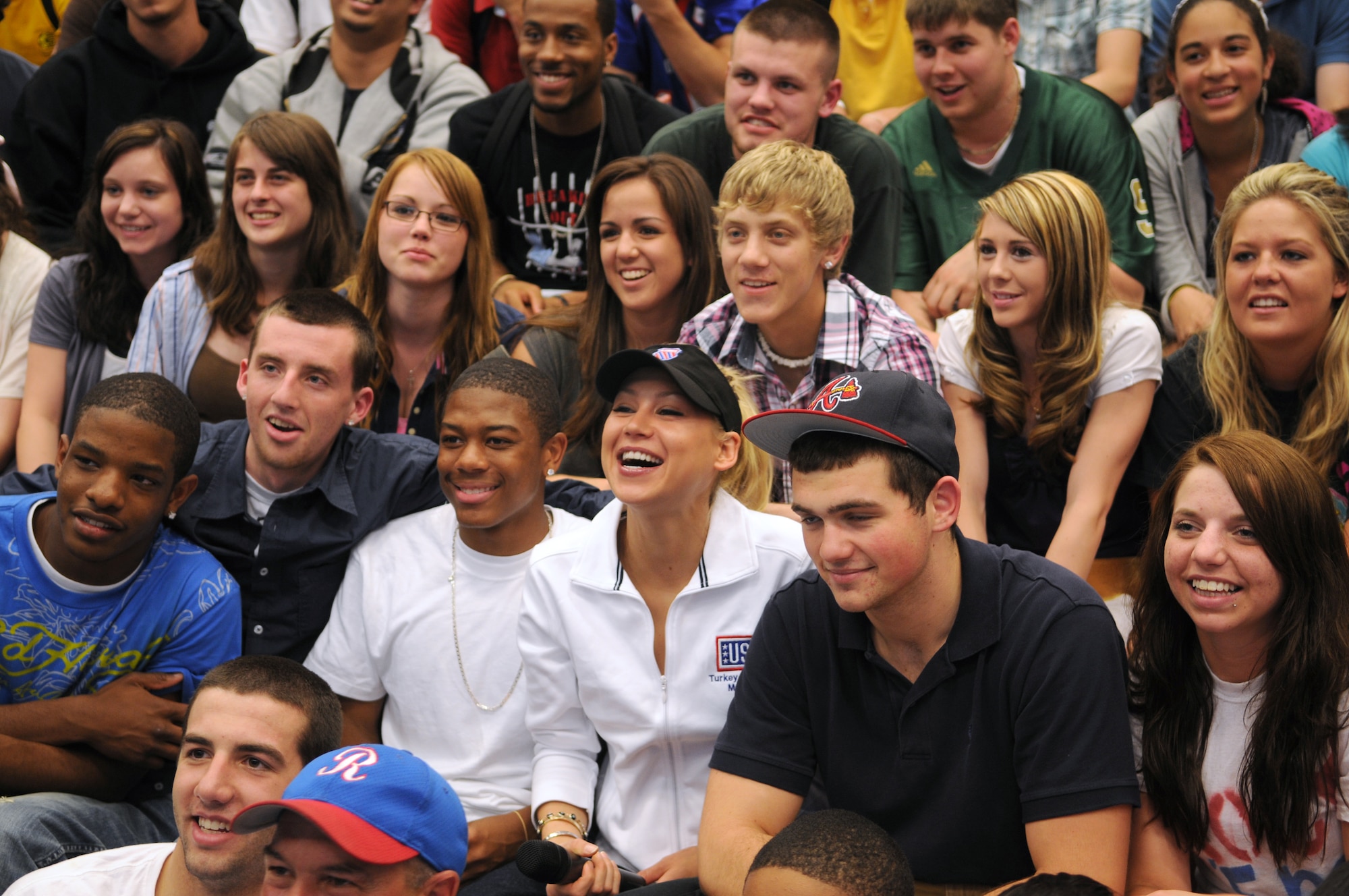 Anna Kournikova (center), former professional tennis player, poses with students at Ramstein High School, Ramstein Air Base, Germany, May 19, 2009, after talking to them about school, her tennis career and working hard.  Kournikova visits with students as part of a six-day educational United Service Organizations tour. (U.S. Air Force photo by Airman 1st Class Grovert Fuentes-Contreras)