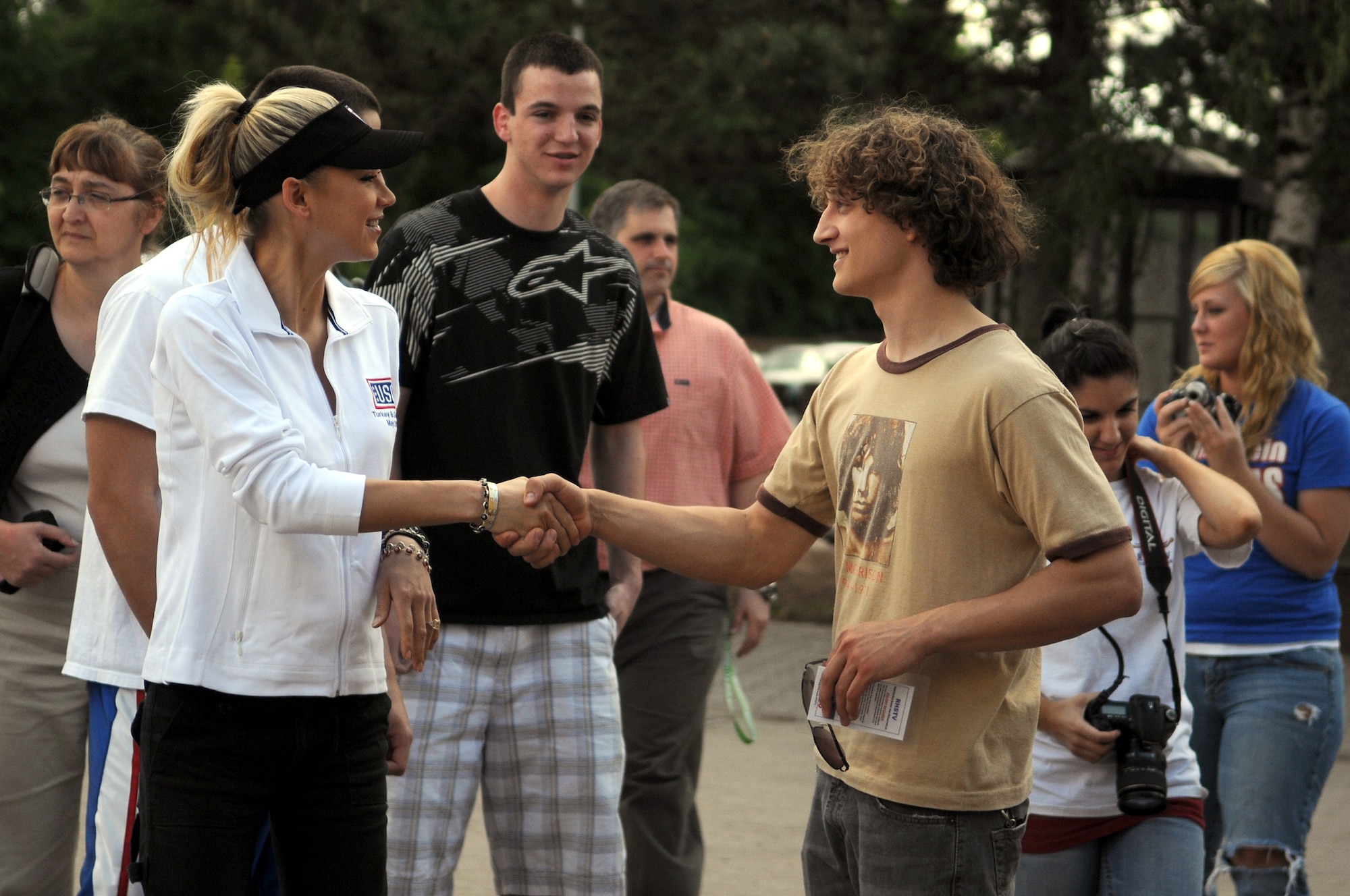 Anna Kournikova (left), former professional tennis player, greets students at Ramstein High School, Ramstein Air Base, Germany, May 19, 2009, before talking to them about school, her tennis career and working hard. Kournikova visits with students as part of a six-day educational United Service Organizations tour. (U.S. Air Force photo by Airman 1st Class Grovert Fuentes-Contreras)