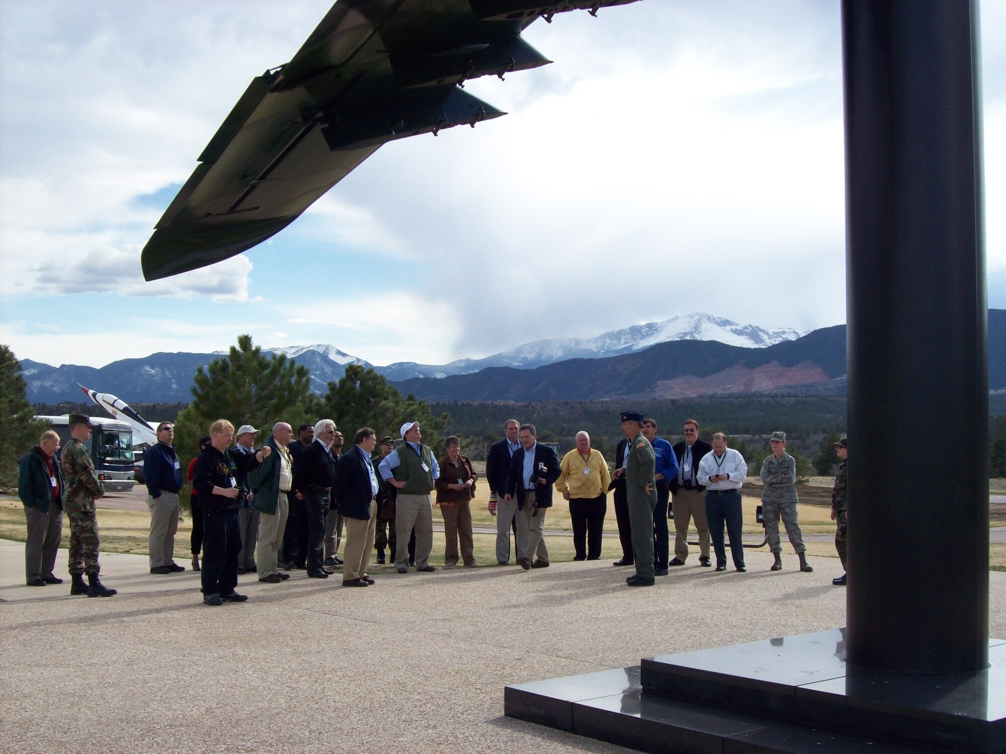 Col. Robert Swain Jr., 439th Airlift Wing commander, explains to civic leaders how he shot down an Iraqi helciopter with the A-10 Thunderbolt II he flew during the first Golf War. The aircraft pictured is on display at the Air Force Academy, and nickamed the “chopper popper.” Twenty-three leaders from western Massachusetts toured the academy and Peterson Air Force Base, Colo. (US Air Force photo/Senior Master Sgt. Sandi Michon)