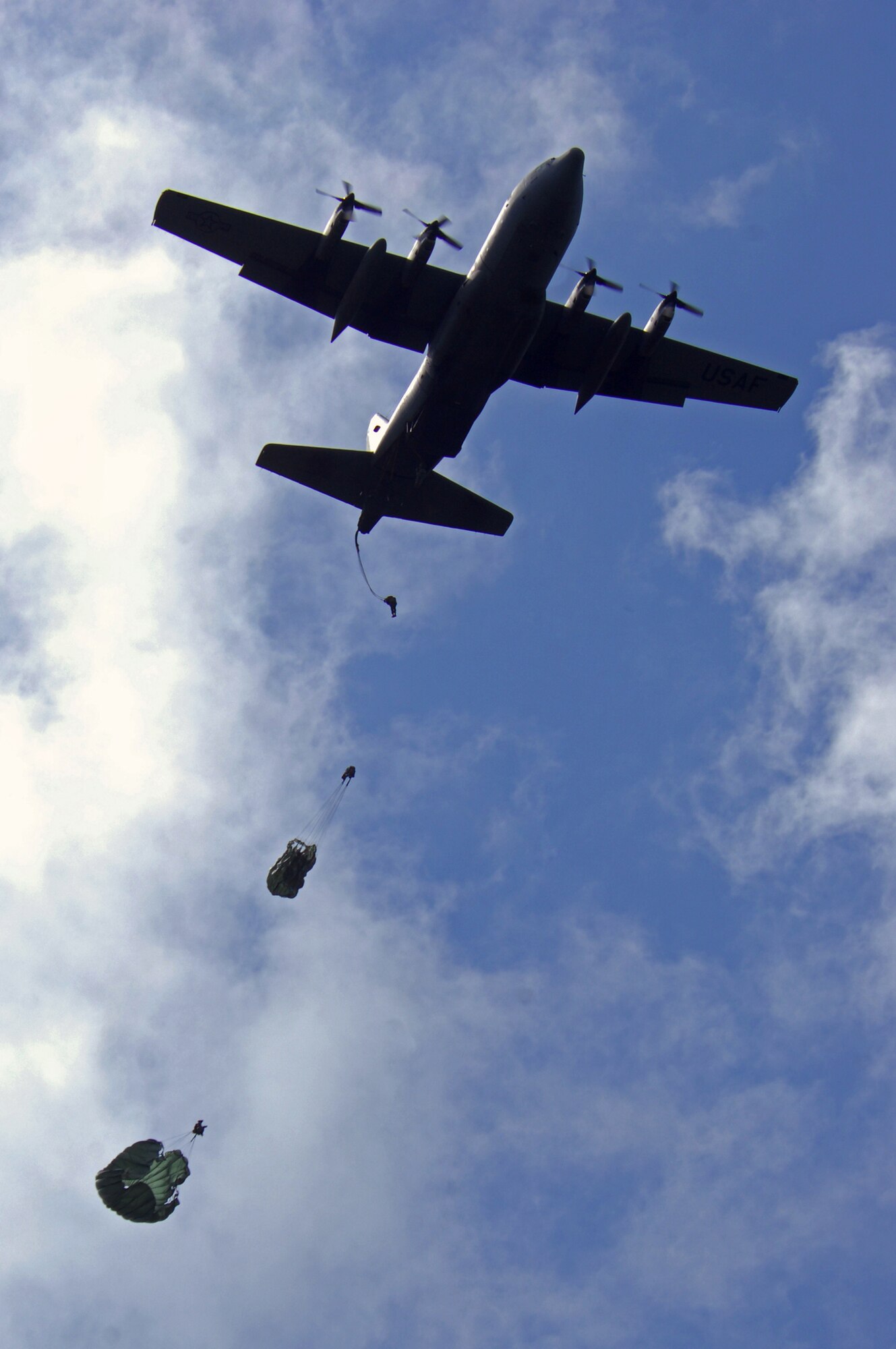 United States Air Force paratroopers with the 86th Contingency Response Group jump from a C-130 Hercules as a part of an airfield assessment team during an Operational Readiness Exercise, May 20, 2009, West Freugh Airfield, Scotland. (U.S. Air Force photo by Senior Airman Kenny Holston)