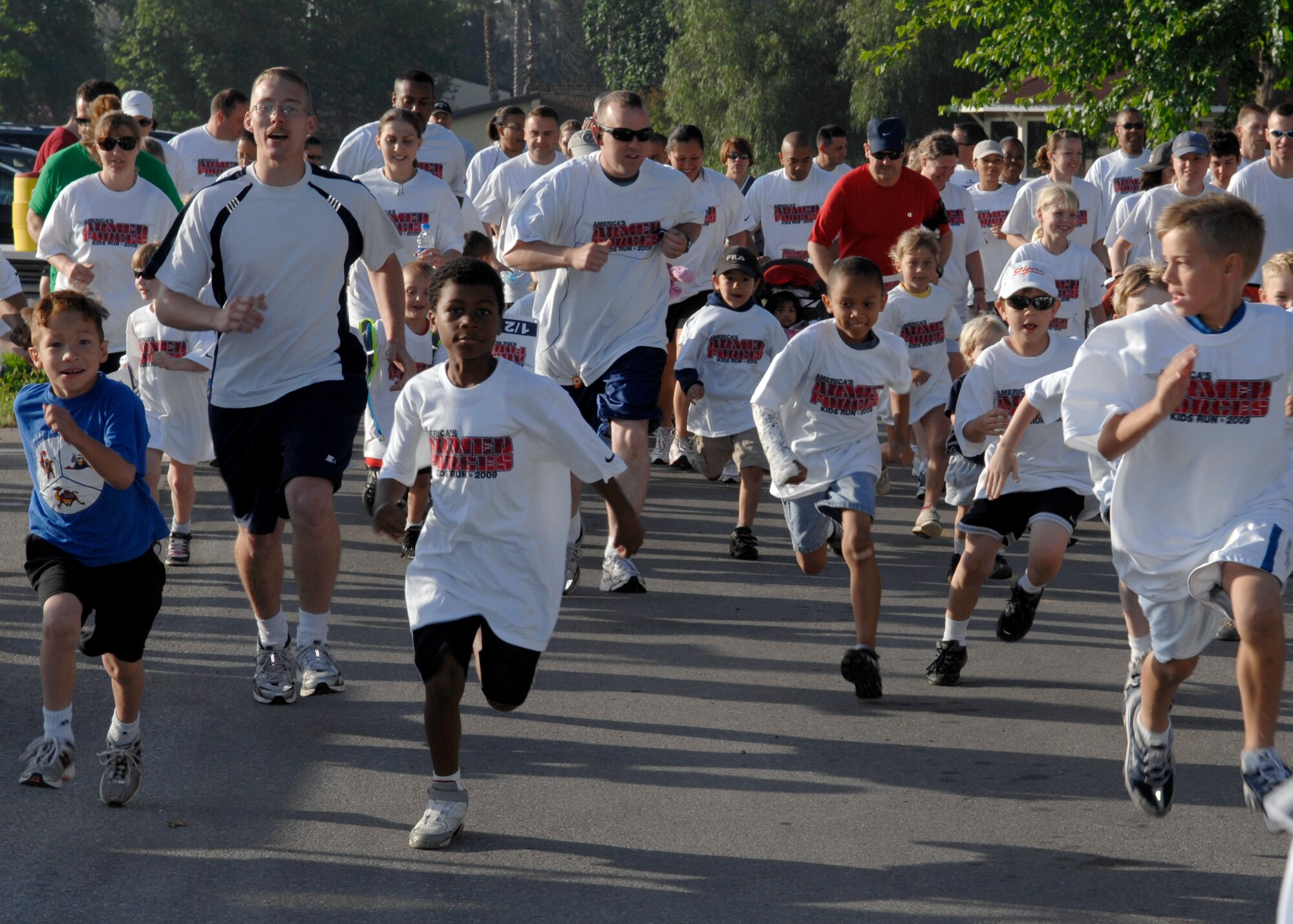 Servicemembers, families and children alike start to run the Incirlik Physical Training Triangle during the Armed Forces Kids Run Saturday, May 16, 2009. This was the 25th Annual Armed Forces Kids Run observed worldwide, promoting the health and fitness of military children and families. (U.S. Air Force Photo/Master Sgt. Edward D. Holzapfel)