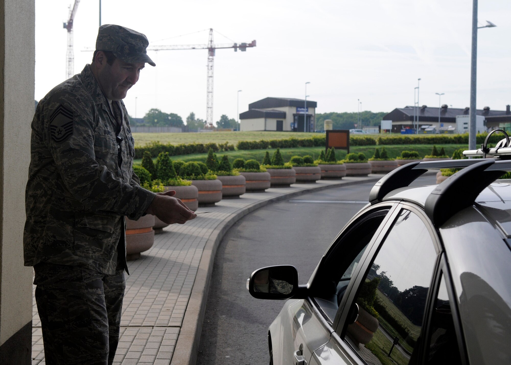 SPANGDAHLEM, Germany – Chief Master Sgt. John Burns, 52nd Maintenance Group, works at the main gate as part of the “walk in their shoes” program May 20, 2009. The newly created program allows Chiefs to experience different aspects of the base. (U.S. Air Force photo by Airman 1st Class Staci Miller)