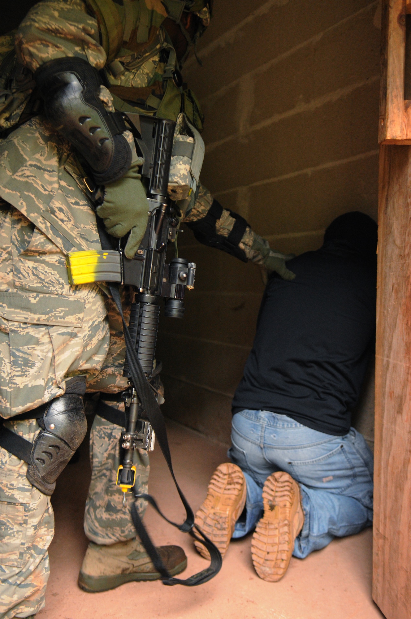 A suspected insurgent is searched during Creek Defender, Baumholder, Germany, May 15, 2009. Students attend Creek Defender Regional Training Center to hone and sharpen skills learned through previous training in preparation for upcoming deployments. (U.S Air Force photo by Senior Airman Levi Riendeau)