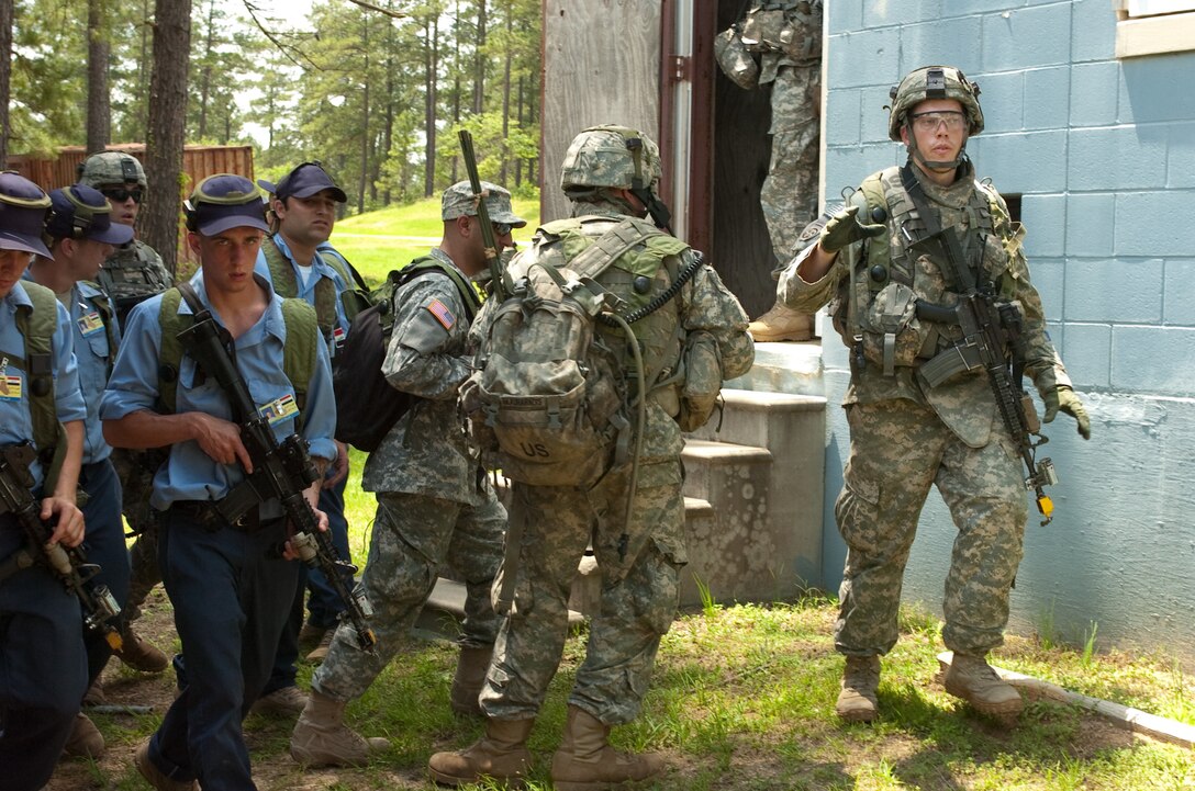 U.S. Army soldiers prepare to provide security to a fictitious Iraqi town set up on Joint Readiness Training Center, Fort Polk, La., in a role-playing exercise designed to teach them to train Iraqi forces once deployed, May 15, 2009. In this exercise, U.S. Army 2nd Lieutenant John J. Griffin leads the 3rd Platoon in providing security during the opening of a new police station in the fictional town of Suliyah, Iraq. The soldiers are assigned to the 82nd Airborne Division's Company C, 2nd Battalion, 504th Parachute Infantry Regiment, 1st Brigade Combat Team.