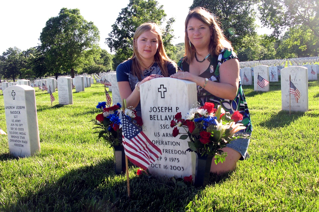 Christine Bellavia, right, and her sister, Amelia Stillwell, visit the grave of husband, U.S. Army Staff Sgt. Joseph Bellavia at Arlington National Cemetery, Va., May 21, 2009. The 101st Airborne Division soldier was killed in Karbala, Iraq, Oct. 16, 2003. “I think about him and remember him every single day,” she said.