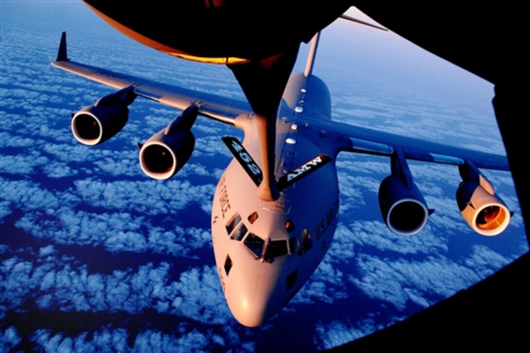 A C-17A Globemaster III aircraft from the 729th Airlift Squadron approaches a KC-135R Stratotanker aircraft from the 336th Air Refueling Squadron during an aerial refueling training mission over the Pacific Ocean, May 20, 2009. The aircraft are attached to the 452nd Air Mobility Wing, March Air Reserve Base, Calif. 