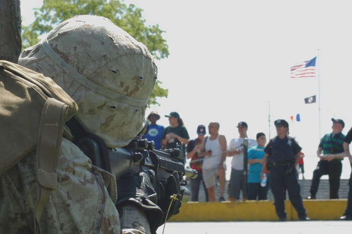Marines from Special Purpose Marine Ground Task Force New York secure a landing zone during helicopter raid demonstation at Orchard Beach in he Bronx May 22. (Official Marine Corps photo by Lance Cpl. Jad Sleiman)