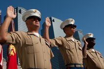 Gunnery Sgt. Justin Smith, from Cape Code, Ma., and platoon sergeant for 3rd platoon, Company C, 2nd Amphibian Assault Battalion, 2nd Marine Expeditionary Force, Staff Sgt. Deryck Smith, from Jacksonville, Fla. and substance abuse control officer for Headquarters and Support Company, 2nd Tank Battalion, 2nd MEF, and Staff Sgt. Jonathan Novak, from Villa Park, Ill., and section leader for 3rd platoon, Co. C, 2nd AA Bn., 2nd MEF, reenlist at the construction site of the Freedom Town in lower Manhattan, May 22. The Marines requested, and waited, to conduct the ceremony at the site of what was the World Trade Center. Lt. Gen. Richard F. Natonski, commander for U.S. Marine Corps Forces Command, reenlisted the Marines as part of his during Fleet Week 2009. (Official Marine Corps photo by: Cpl. Patrick Fleischman)