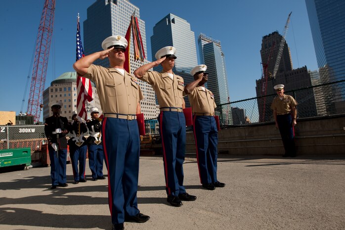 Gunnery Sgt. Justin Smith, from Cape Code, Ma., and platoon sergeant for 3rd platoon, Company C, 2nd Amphibian Assault Battalion, 2nd Marine Expeditionary Force, Staff Sgt. Deryck Smith, from Jacksonville, Fla. and substance abuse control officer for Headquarters and Support Company, 2nd Tank Battalion, 2nd MEF, and Staff Sgt. Jonathan Novak, from Villa Park, Ill., and section leader for 3rd platoon, Co. C, 2nd AA Bn., 2nd MEF, reenlist at the construction site of the Freedom Town in lower Manhattan, May 22. The Marines requested, and waited, to conduct the ceremony at the site of what was the World Trade Center. Lt. Gen. Richard F. Natonski, commander for U.S. Marine Corps Forces Command,  reenlisted the Marines as part of his during Fleet Week 2009. (Official Marine Corps photo by: Cpl. Patrick Fleischman)